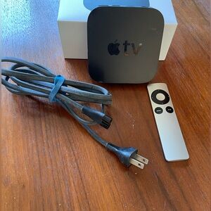 Apple TV with cord and remote